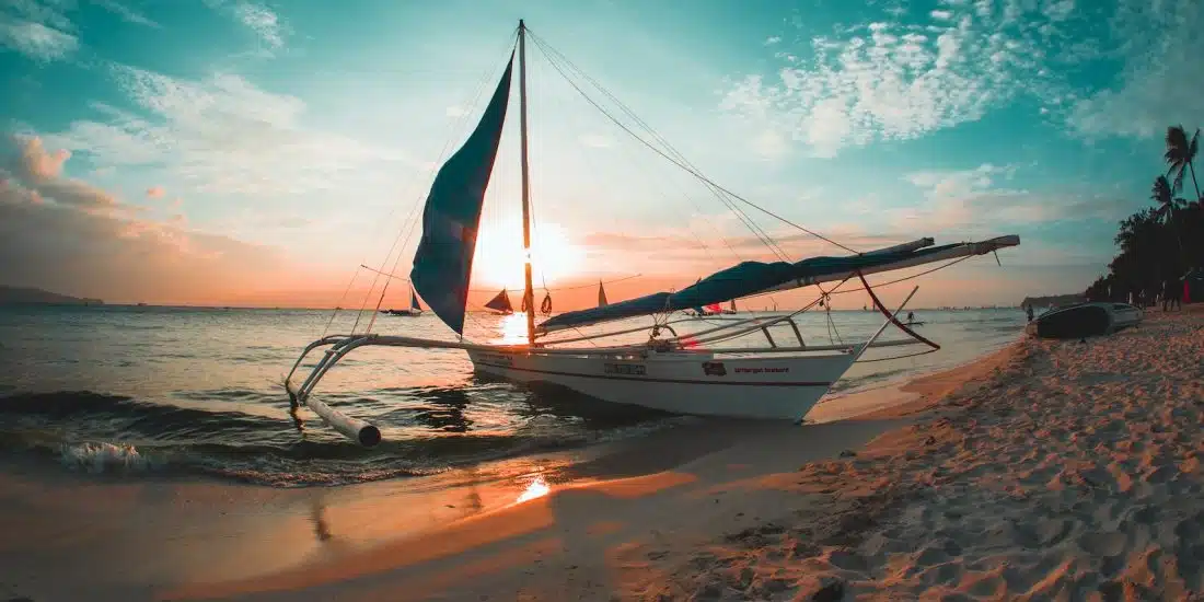 white boat docked on seashore